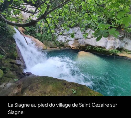 a waterfall in the middle of a river at Gîte Le Figuier de Saint Ce Jardinet Terrasse Vue in Saint-Cézaire-sur-Siagne