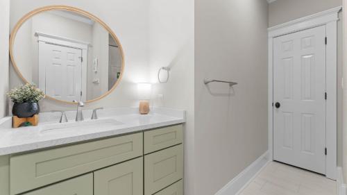 a bathroom with a sink and a mirror at Paradise Pointe by AvantStay Lakefront Views Playset in Lake Norman of Catawba