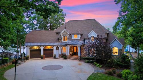 a house with a driveway at Paradise Pointe by AvantStay Lakefront Views Playset in Lake Norman of Catawba