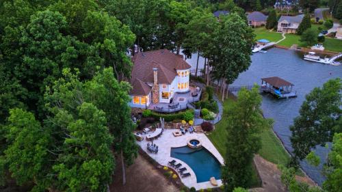 an aerial view of a house on the water at Paradise Pointe by AvantStay Lakefront Views Playset in Lake Norman of Catawba