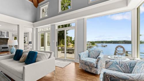a living room with a couch and chairs at Paradise Pointe by AvantStay Lakefront Views Playset in Lake Norman of Catawba