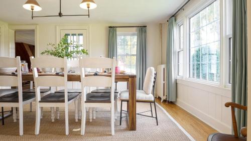 a dining room with a table and chairs at Whitney by AvantStay Private Berkshires Estate in Sheffield