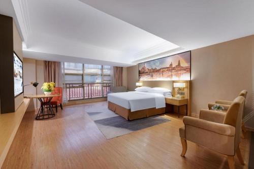 Postel nebo postele na pokoji v ubytování Vienna International Hotel Nanning East Station