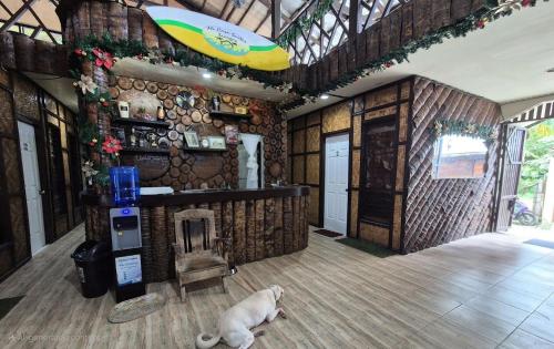 a dog laying on the floor in a room at Mi casa suites in General Luna