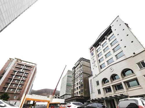 a group of tall buildings in a city at Nostalgia Hotel in Paju