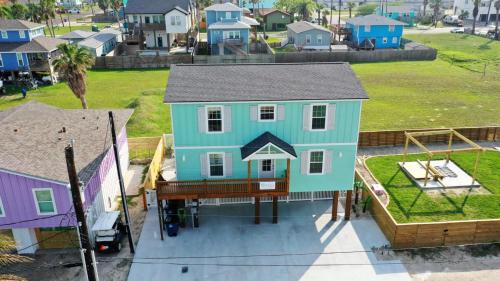 a house on the back of a house at Private Pool Free Golf Cart 3 Blocks to Town Tequila Tides by AvantStay in Port Aransas