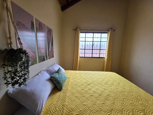 a bedroom with a bed and a window at Hotel Casona Macondo, Granada, Nicaragua in Granada