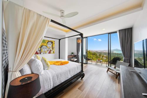 a bedroom with a bed and a large window at Villa Fanta Sea - Luxury Residence at Chaweng Noi in Koh Samui 