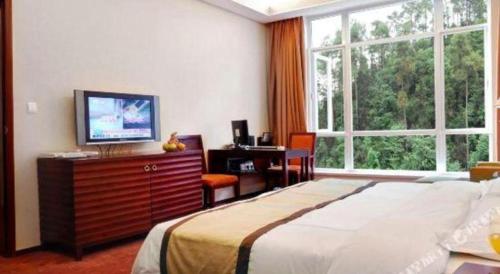 Letto o letti in una camera di Hongzhushan Hotel Mount Emei
