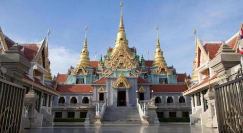 a large building with gold spires on top of it at Seascape Resort Baan Krood in Ban Krut