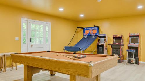 a room with a pool table and a slide at Game Farm Villa by AvantStay 10BDR Private Pond Spa Pool Family-Friendly in Catskill