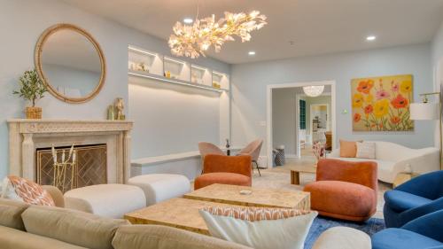 a living room with a couch and a fireplace at Game Farm Villa by AvantStay 10BDR Private Pond Spa Pool Family-Friendly in Catskill