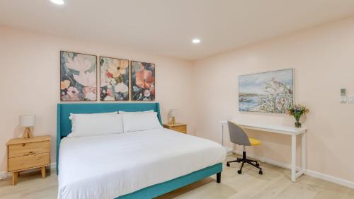 a bedroom with a bed and a desk and a bed at Game Farm Villa by AvantStay 10BDR Private Pond Spa Pool Family-Friendly in Catskill