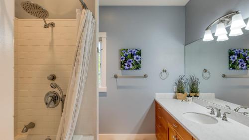 a bathroom with a shower and a sink at Sunny Backyard Fireplace Coastal Access in Peaceful Neighborhood Near Shopping in Langley