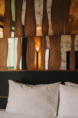 Postel nebo postele na pokoji v ubytování Cyrus Hotel
