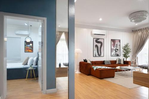 two views of a living room and a bedroom at Luxury 3 bedroom apartment in lekki cadogan estate in Ikota
