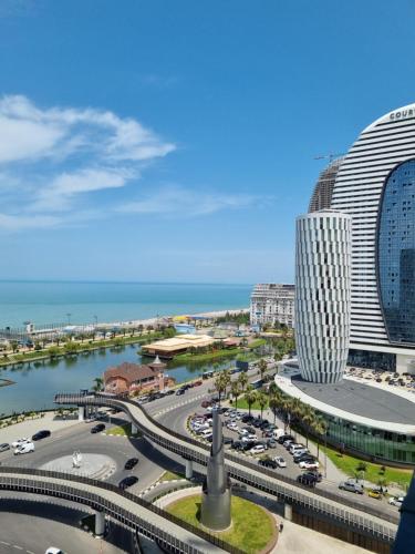 a view of a city with a large building at ORBI CITY amazing holiday in Batumi