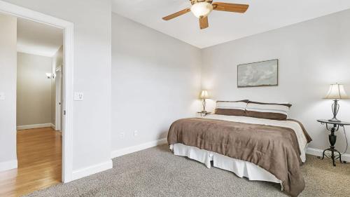 a bedroom with a bed and a ceiling fan at Fairview Vista by AvantStay 10 Mins to Asheville in Fairview