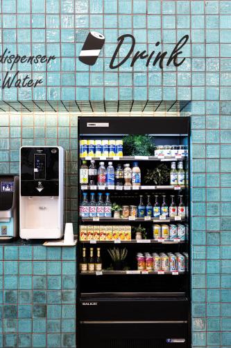 a drink refrigerator in a store with drinks at Prince Smart Inn Nagoya Sakae in Nagoya