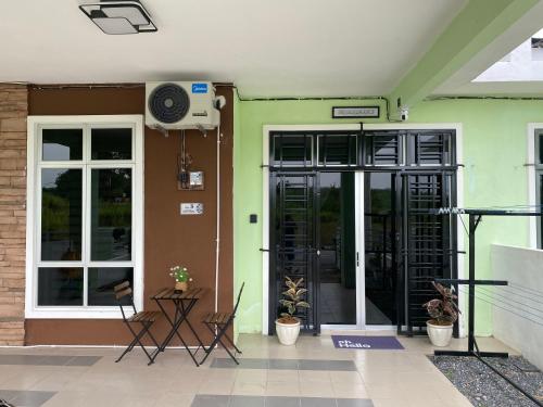 an entrance to a building with a door at Rumah Homestay in Kangar
