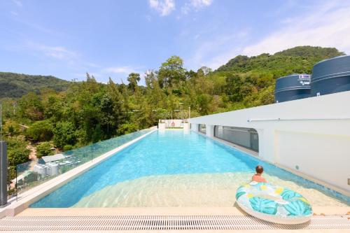a swimming pool on a cruise ship at Kamala - 5 Min to Beach - Family Stay with 2 Baths in Kamala Beach