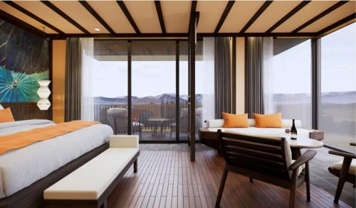 a hotel room with two beds and a balcony at Amiana Resort Cam Ranh in Cam Ranh