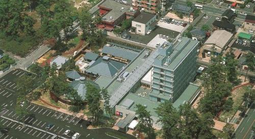 an overhead view of a city with a tall building at Ou Hotel in Yonago