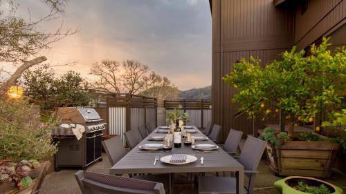 a patio with a table and chairs and a grill at Gable by AvantStay Beautiful 3.5 Acre Oasis w Gorgeous Views Pool Hot Tub in Santa Rosa
