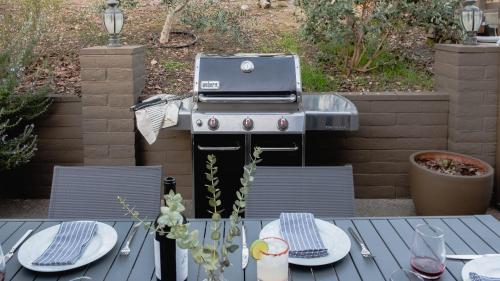 a grill sitting on top of a table on a patio at Gable by AvantStay Beautiful 3.5 Acre Oasis w Gorgeous Views Pool Hot Tub in Santa Rosa