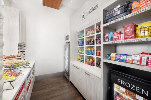 a grocery store aisle with shelves of food at Hilton Garden Inn New York - Times Square Central in New York