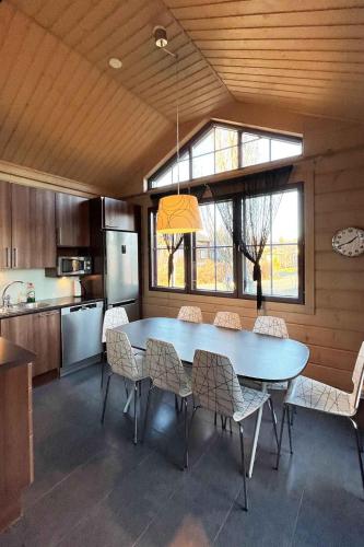 a kitchen with a table and chairs in a room at Himoskunkku in Jämsä