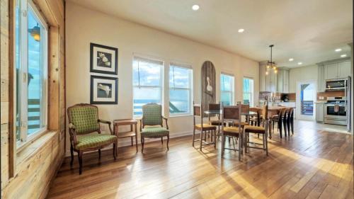 a kitchen and dining room with a table and chairs at Waterfront w Bay Views Shared Pool Boat Dock Marlin Madness by AvantStay in Padre Island