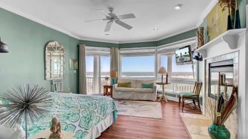 a bedroom with a bed and a view of the ocean at 502 Ocean Blvd by AvantStay Beachfront w Pool Ocean Views in Mount Pleasant