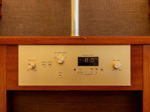 a clock in a wooden box with the number at Prince Smart Inn Nagoya Sakae in Nagoya