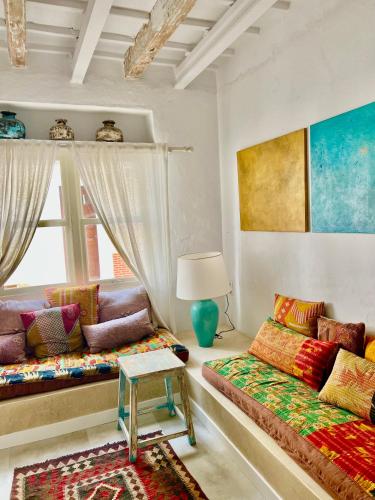 a living room with a couch and a table at Casa Bitxu in Mahón