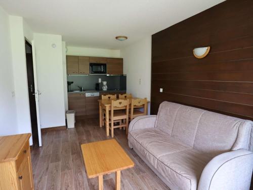 a living room with a couch and a table at Appartement T2 Hauteluce, 4 pers., piscine, parking, WiFi - FR-1-342-322 in Hauteluce