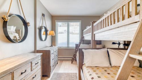 a bedroom with a bunk bed and a staircase at Sunvail by AvantStay 10min Walk to Ski Lifts in Vail
