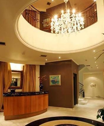 a large lobby with a chandelier in a building at Art Hotel Athens in Athens