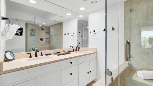 a bathroom with a large sink and a shower at 314 C Shipwatch by AvantStay Gorgeous Condo in Great Community in Isle of Palms
