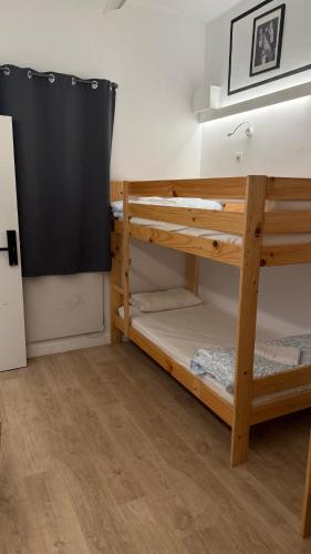 a bedroom with two bunk beds in a room at bcool in Bilbao