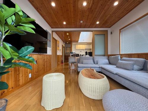 a living room with a couch and a table at UMI&kanzanji in Hamamatsu