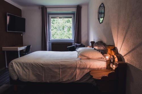 Postel nebo postele na pokoji v ubytování Hotel Du Donon