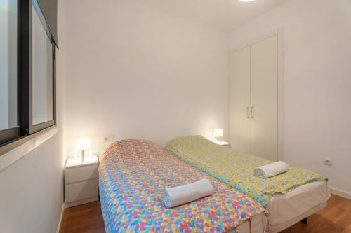 a bedroom with a bed with two pillows on it at Casa Grande in Santa Cruz de Tenerife