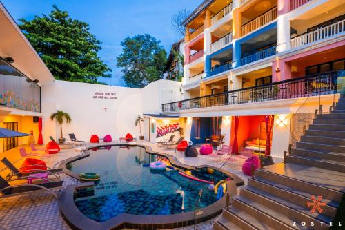 a swimming pool in the middle of a building at Zostel Phuket, Patong Beach Hostel in Patong Beach