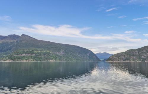 a view of a large body of water with mountains at Awesome Home In Eidfjord With House Sea View in Bu