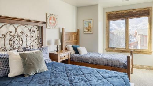 a bedroom with two beds and a window at Blue Skies Lakeside Family-Friendly Getaway w Hot Tub BBQ in Heber City
