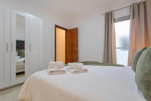 Ένα ή περισσότερα κρεβάτια σε δωμάτιο στο Apartamento Rolycar 204