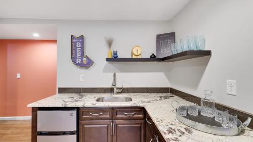 a kitchen with a sink and a counter top at Moshannon Tree-Lined Pocono Retreat w Hot Tub Firepit Pool Table in Pocono Lake