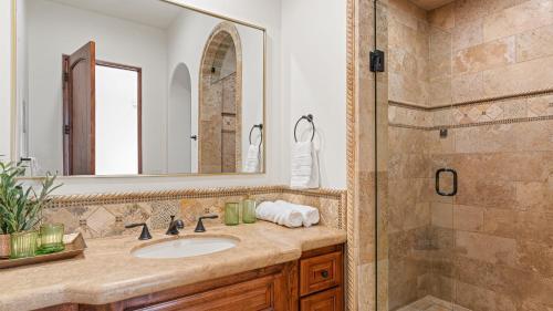 a bathroom with a sink and a shower at Infinity Pool Theater Pickleball 360 Views Near Lake Poway Sunset Point Estate by AvantStay in Rancho Bernardo