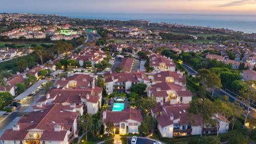an aerial view of a residential neighborhood with houses at Coastal Retreat w Pool Spa BBQ Near Beaches Golf Courses Ritz Pointe Condo by AvantStay in Dana Point